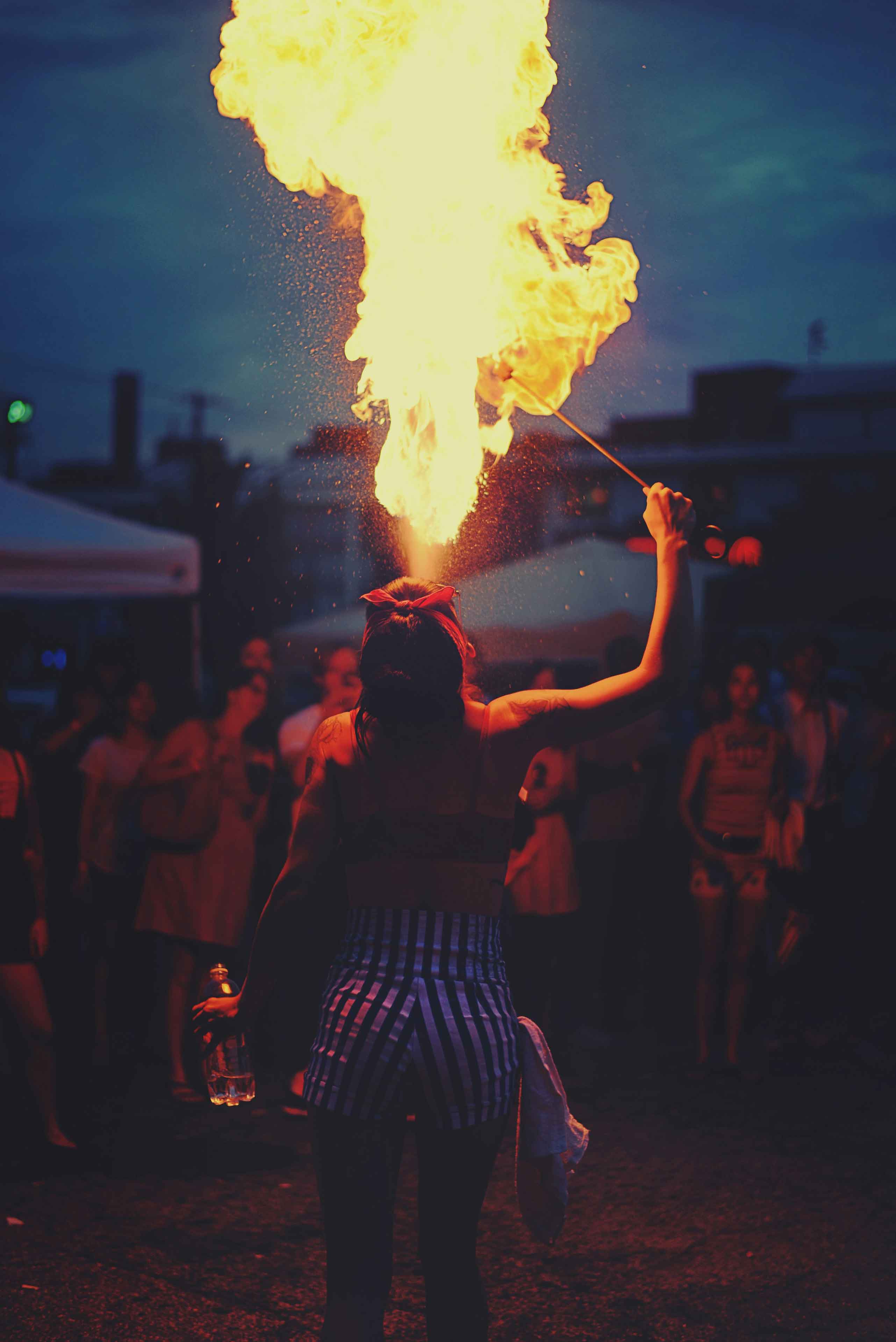 woman spitting fire from her mouth