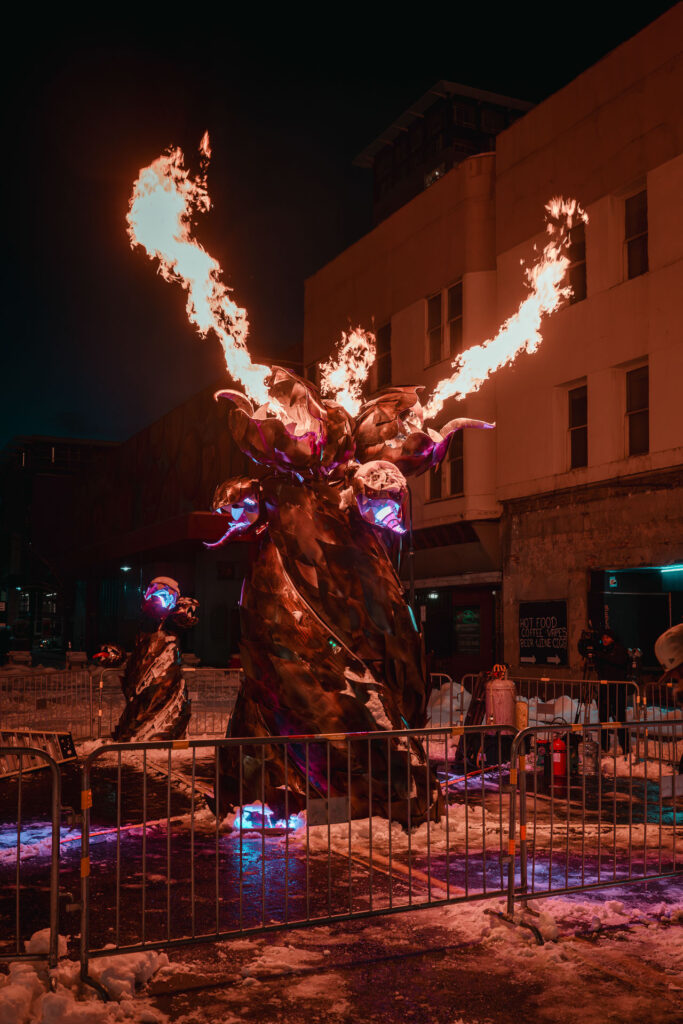 Art piece throwing fire at western lights