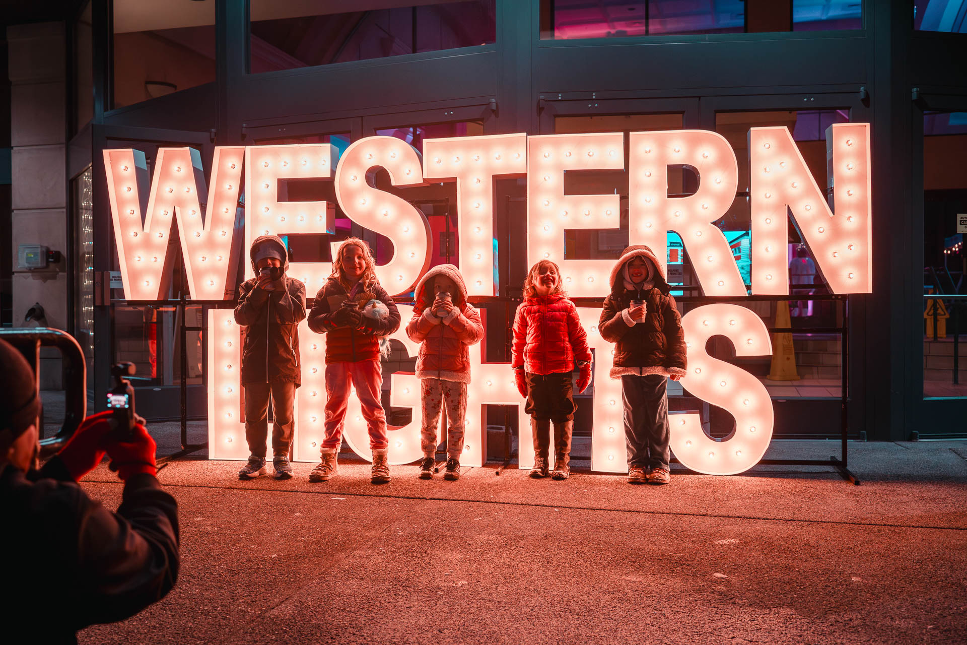 Big western lights sign at the festival entrance